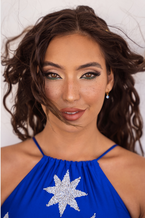 Close-up portrait of a woman in a blue dress